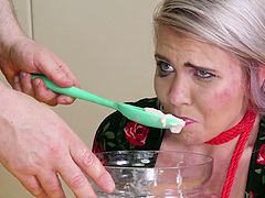 Slave gets a whipped cream enema and eats it
