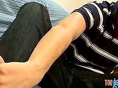 Perverted gay dude rubs his feet and strokes dick solo
