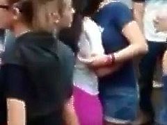 lesbians kissing wildly in a outdoor party