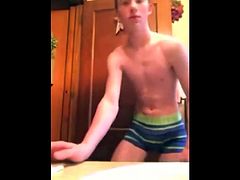 Boy in bathroom talks dirty