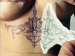 big tits babe getting inked