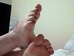 Casually showing off feet soles and toes on cam