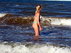 Blonde playing with the waves