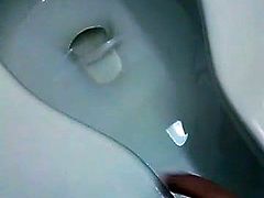 Crazy MILF getting naked in public toilet