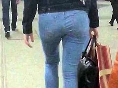 Young woman with hot ass in blue jeans