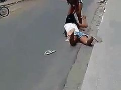 Two black girls fight on the street
