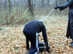 Check out this smoking hot and horny brunette dominant woman walking on a leash her male slave in the forest.Watch this fetish video in HD.