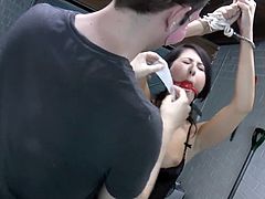 Enjoy yet another sick and fucked up porn video where a brunette woman has her hands tied up behing her back on a chair in the house