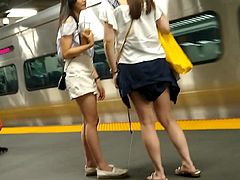Cute Asians waiting for the train