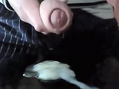 Young man spunking on cam from his uncut cock