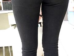 Sexy big ass of a saleswoman in tight jeans in an office