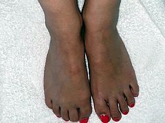 Wife footjob bare feet red nail polish cum