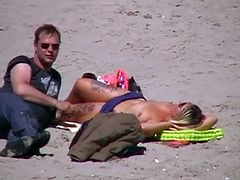 German milf on french beach spy. Shaky quality.