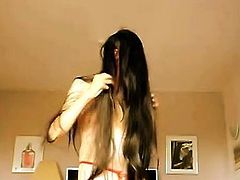 crossdressing nude with a very long wig